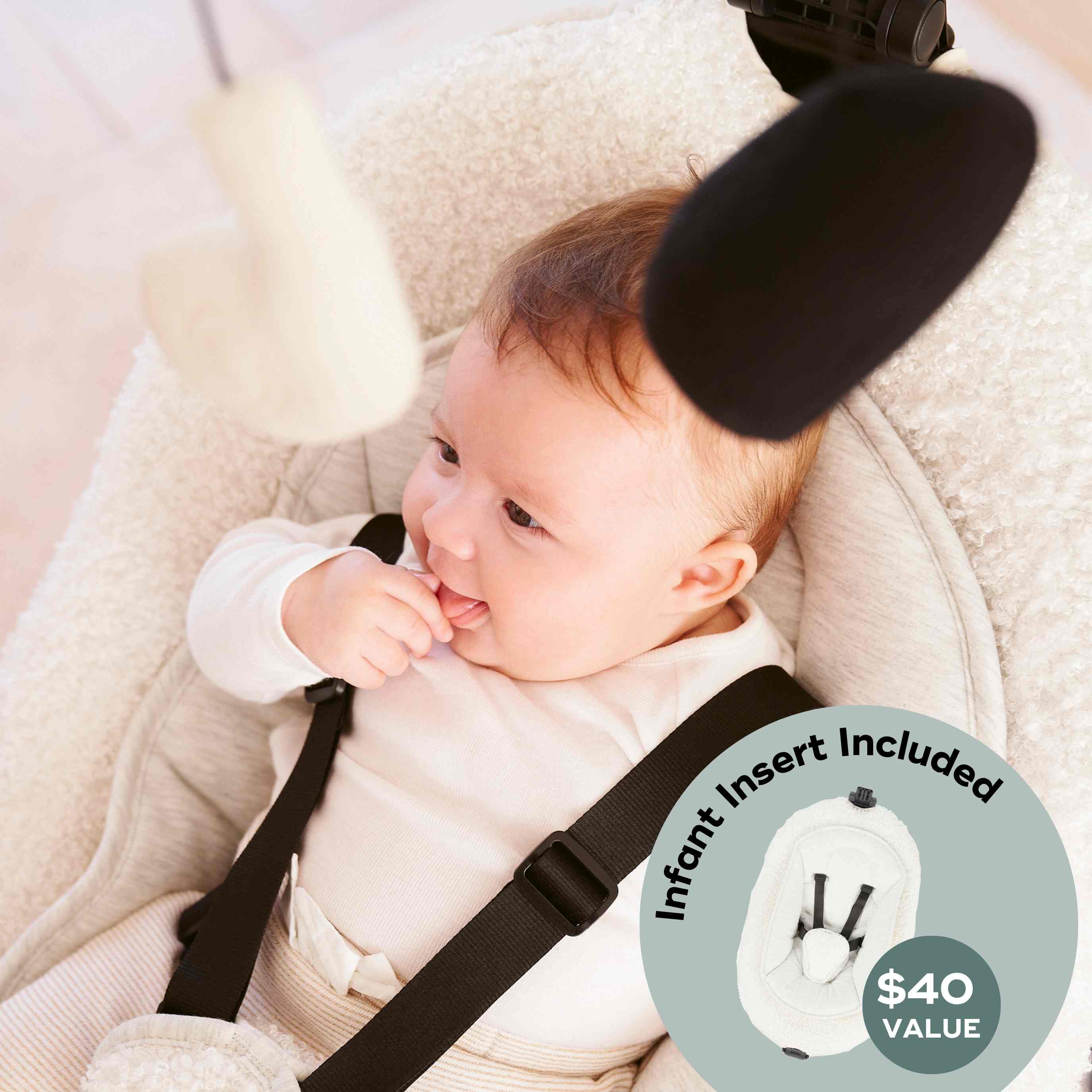 Baby in a baby swing with an infant insert included, showing a $40 value.